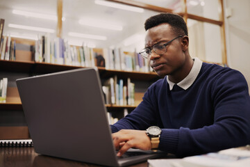 Poster - Student, frustrated and black man typing on a laptop in university or college campus angry due to assignment project. Online, studying and young person prepare for internet exam or doing research