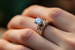 © Planetz - Close up of an elegant engagement diamond ring on woman finger. love and wedding concept.