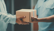 Delivery Man And Parcel Box, Parcels Or Customer Goods In Transit Services, Receive Items From The Courier, Home Delivery, Close-up Of Delivery Man Delivering Holding Parcel Box To Customer.