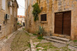 A street in Supetar on Brac Island, Croatia, with traditional kogule or kogulavanje paving. Common in coastal villages throughout Dalmatia, it uses pebbles from beach