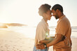 © Anela/peopleimages.com - Beach sunset, forehead and laughing black couple bonding, connect and enjoy relax summer, funny joke or honeymoon together. Romantic love, flare and African people on holiday, intimate date or travel