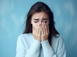 © Vladislava - Closeup portrait photo of young crying attractive woman with unhappy sad face, problem, depressed, offended isolated on modern pastel blue color background, AI Generated