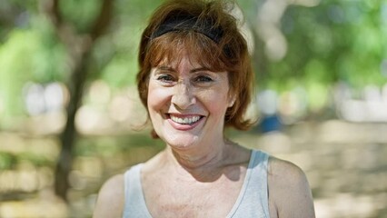 Poster - Middle age woman smiling confident standing at park