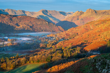Wall Mural - autumn colours in lake district landscape, misty valley of elterwater and langdale.