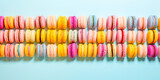 Fototapeta Tęcza - macarons dessert with vintage pastel tones. close up. Small French cakes. Culinary and cooking concept.