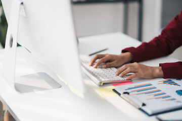 Poster - Hands of businessman working on keyboard keyboard searching work document on computer screen.