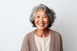 © Anne-Marie Albrecht - Portrait of a happy senior asian woman smiling on white background