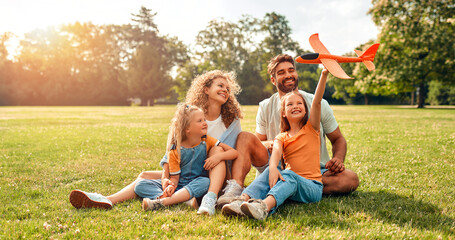 Happy family relaxing in the park