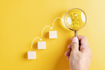 Aufkleber - Business growth success achievement to trophy concept, Magnifier focus and arranging wooden block stacking as step stair or ladder for planning to goal.