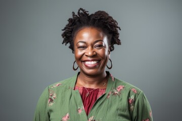 Wall Mural - Portrait of a beautiful african american woman smiling at the camera