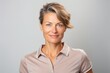 © Eber Braun - Portrait of a middle aged woman with short hair on a gray background