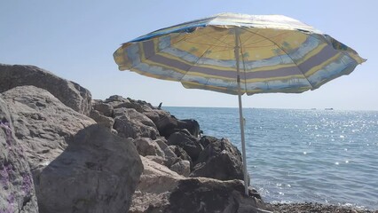 Poster - Beach umbrella on the background of blue sky.