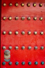 Antique Red Wooden Door With Numerous Bolts
