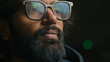 © Yuliia - Thoughtful serious Indian businessman in eyeglasses looking away lost in thoughts thinking. Close up focused pensive bearded Arabian man with lights green reflection in glasses. Business vision idea