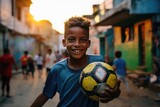 Portrait of a brazilian boy holding a soccer ball and looking at the camera in a favela in Rio de Janeiro