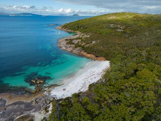 Sticker - Aerial view of a tropical island, with white sandy beaches, blue waters and green plantation