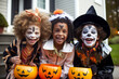 Kids trick or treat in Halloween costume. Happy Halloween