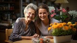 An elderly woman being supported by a kind nurse..