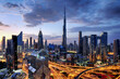 Dubai modern skyline  architecture by night with illuminated skyscrapers, United Arab Emirates