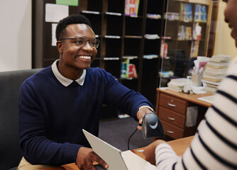 Poster - Happy librarian man, scan books and help desk for learning, knowledge and administration with technology. African people, library employee and receptionist for study, information and education