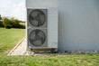 Powerful air conditioning or heat pump outdoor unit with two fans, green energy house of future concept