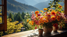 Autumn Flowers In Pots On The Balcony Of The Chalet, View Of The Autumn Mountains From The Hotel On A Trip In October