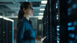 © AspctStyle - Successful young female data center it specialist using a digital tablet while working in a server room