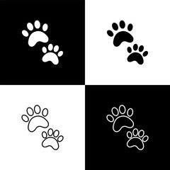 Canvas Print - Set Paw print icon isolated on black and white background. Dog or cat paw print. Animal track. Vector