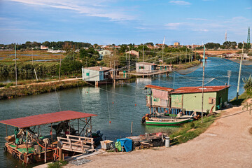 Wall Mural - Comacchio, Ferrara, Italy: landscape of the wetland with fishing huts