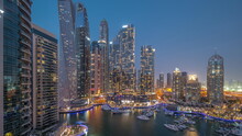 Dubai Marina Tallest Skyscrapers And Yachts In Harbor Aerial Day To Night Timelapse.