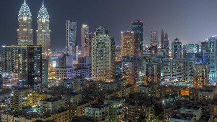  Skyscrapers in Barsha Heights district and low rise buildings in Greens district aerial day to night timelapse.