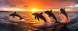 Fototapeta Zachód słońca - Exhilarating dolphins leaping from sparkling ocean, their bodies sketching arches mid-air against breathtaking sunset colors - a jubilant wildlife spectacle.
