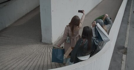 Wall Mural - Girls making selfie after shopping