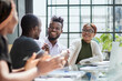 © Katsiaryna - Smiling african american man shaking hands with a business partner at a meeting, greeting, getting to know