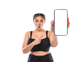 Size plus model advertises black friday sale in online shop with big sizes. Dietetic fitness program template. Girl demonstrates the screen of a smartphone for the presentation of a mobile application