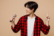 Young singer man of Asian ethnicity he wears red shirt casual clothes sing song in microphone point index finger up at karaoke club isolated on plain pastel light beige background. Lifestyle concept.