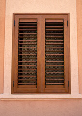 Wall Mural - Traditional new brown window shutters as blinds in Europe