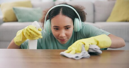 Sticker - Housekeeping, headphones and woman wipe the table with detergent, cloth and gloves at home. Female maid, cleaner or housewife listening to music, playlist or radio while cleaning furniture for dust.