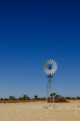 Wall Mural - Windmill or water pump, Kalahari, South Africa