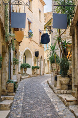 Poster - Old stone houses on a street in medieval Saint Paul de Vence, South of France