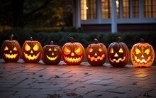Halloween Scary Jack-o-lantern Pumpkins On A Ground