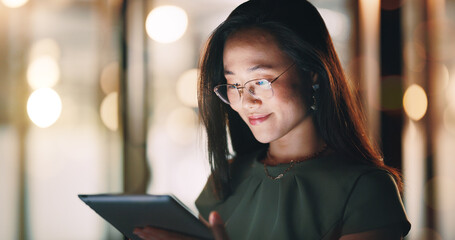Poster - Corporate woman, reading tablet and night with smile, focus and happy for email communication, chat or app. Asian executive, social media marketing and working in night on web, tech or social network