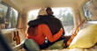 © Felix/peopleimages.com - Hug, winter and a couple in a car for a road trip, date or watching the view together. Happy, travel and back of a man and woman with an affection in transport during a holiday or camping in nature