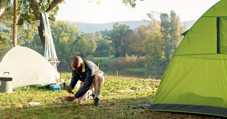 Sticker - Camping, tent and black man setup in woods for shelter on outdoor holiday, vacation and adventure, Campsite, traveling and male person with hammer for pins for gear in nature, forest and countryside