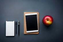 Notebook With Word "Homework", Textbooks And Apple On Grey Background, Top View
