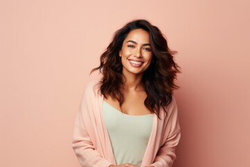 smiling african american woman in sweatshirt on pink background