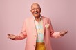 © Leon Waltz - Portrait of happy senior man in a pink suit and yellow pants.