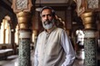 © Leon Waltz - Portrait of a bearded Indian man standing in the middle of the mosque