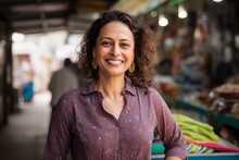 Medium Shot Portrait Of An Indian Woman In Her 40s In Her 40s Wearing A Cardigan In An Indian Market Or Bazaar