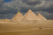 Giza Pyramids on a rare cloudy day - Cairo, Egypt	